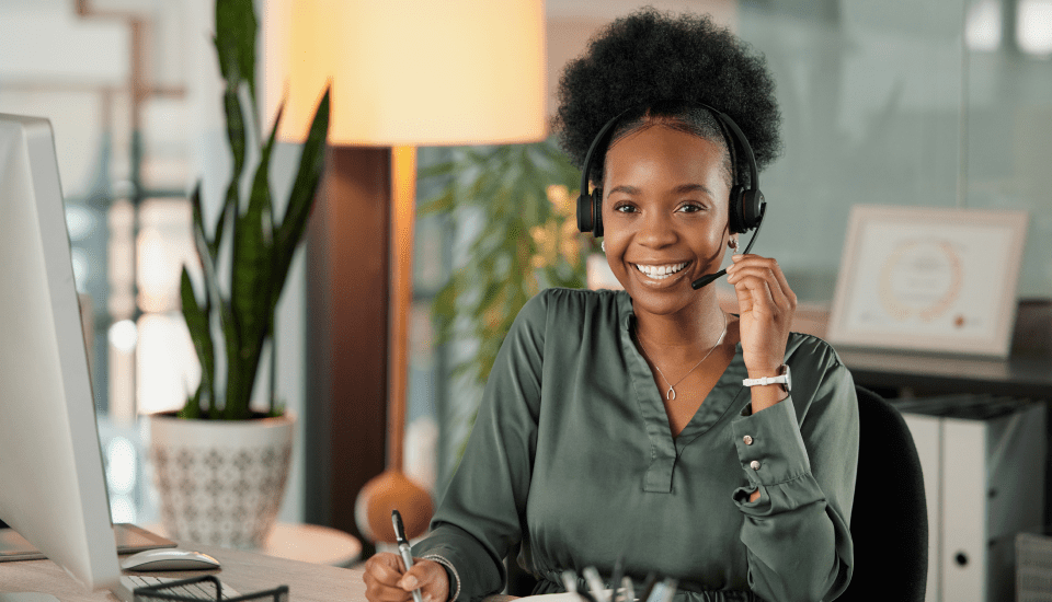 happy-customer-service-representative-serving-client-over-the-phone