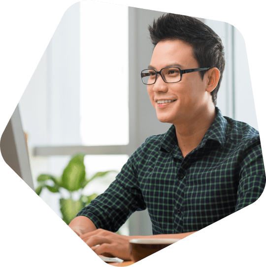 Professional-appointment-setting-services-employee-smiling-at-his-desk