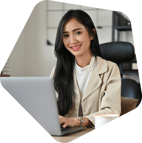 outsource-customer-service-employee-happy-at-her-desk