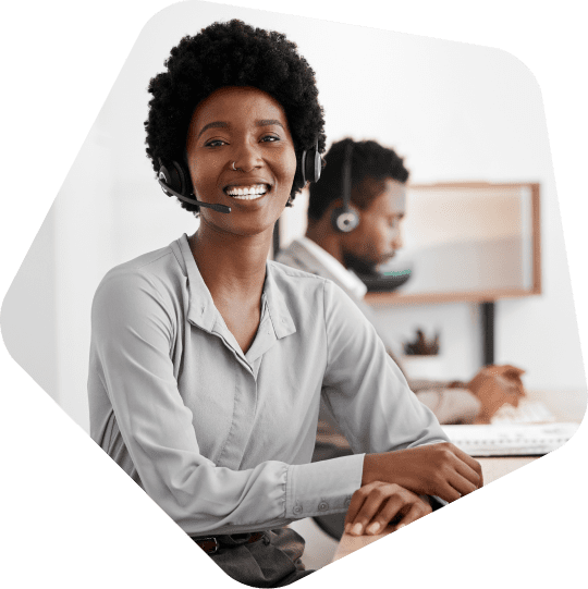 smiling-offshore-executive-assistants-employee-sitting-at-her-desk