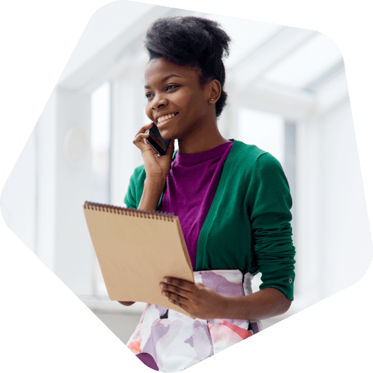 woman-on-the-phone-talking-to-offshore-recruitment-agencies-smiling