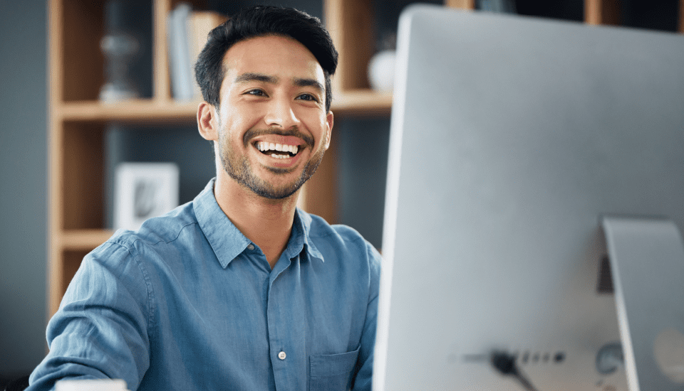 Employee-sitting-at-desk-using-Offshore-recruitment-agencies