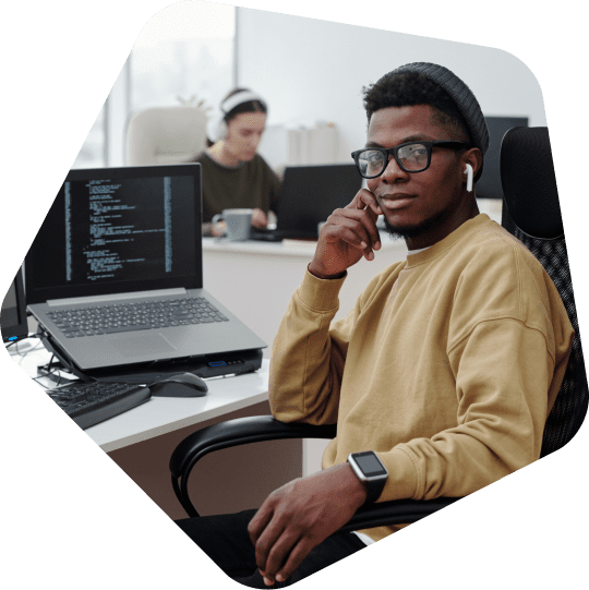 offshore-sales-engineer-at-his-desk-looking-at-camera