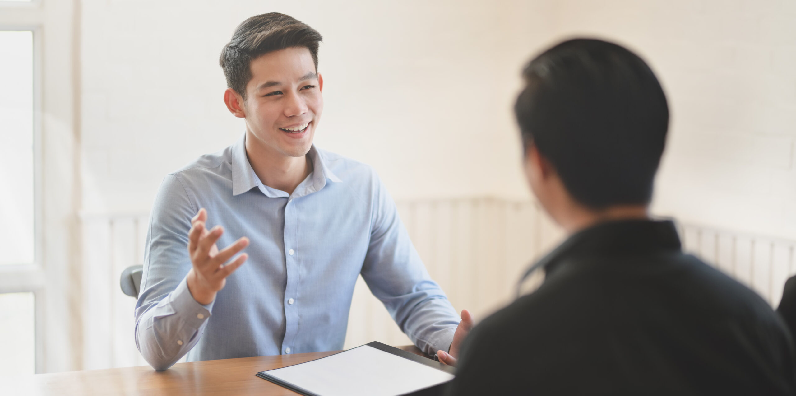 Professional businessman explaining his idea  to his team member