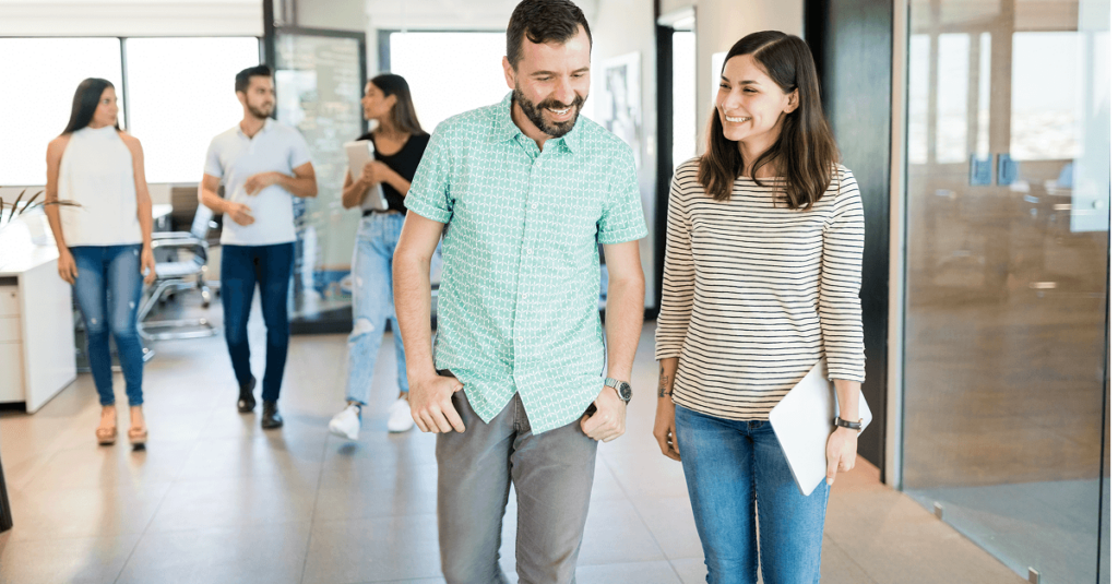 Two people walking and talking