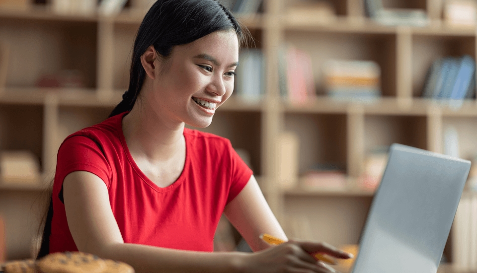 E-commerce business owners using laptop to process orders