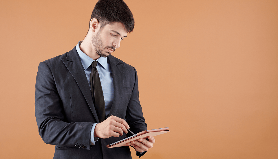 Person jotting down notes for successfully hiring an e-commerce administrator