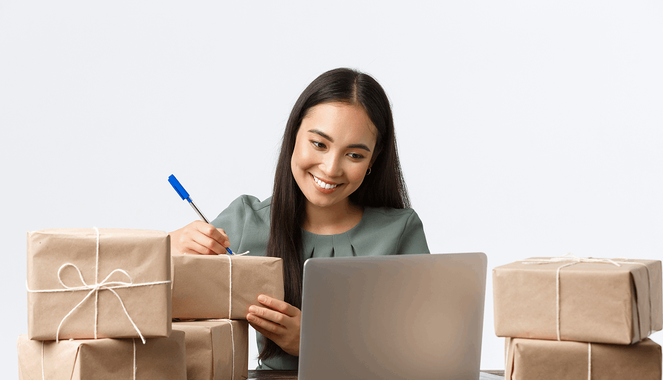 Happy women listing her tasks for her business products