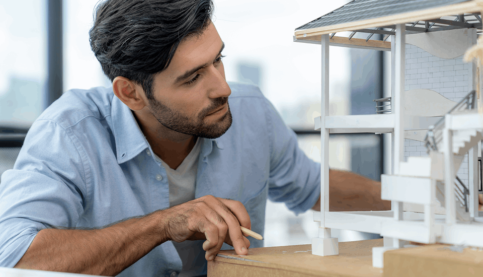 Architect building 3D model for construction outsourcing