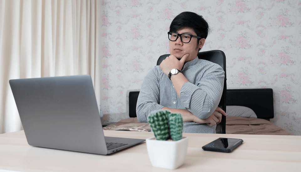 An outsourced IT specialist ensuring eCommerce data security on a laptop