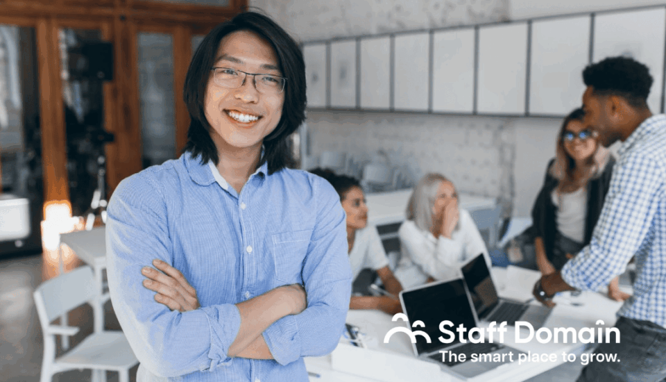 Guy happily posing for a picture because he is proud to know about offshoring for business