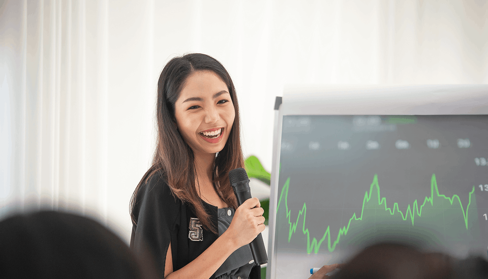 Female businesswoman happy about the benefits of one-click ordering on her business