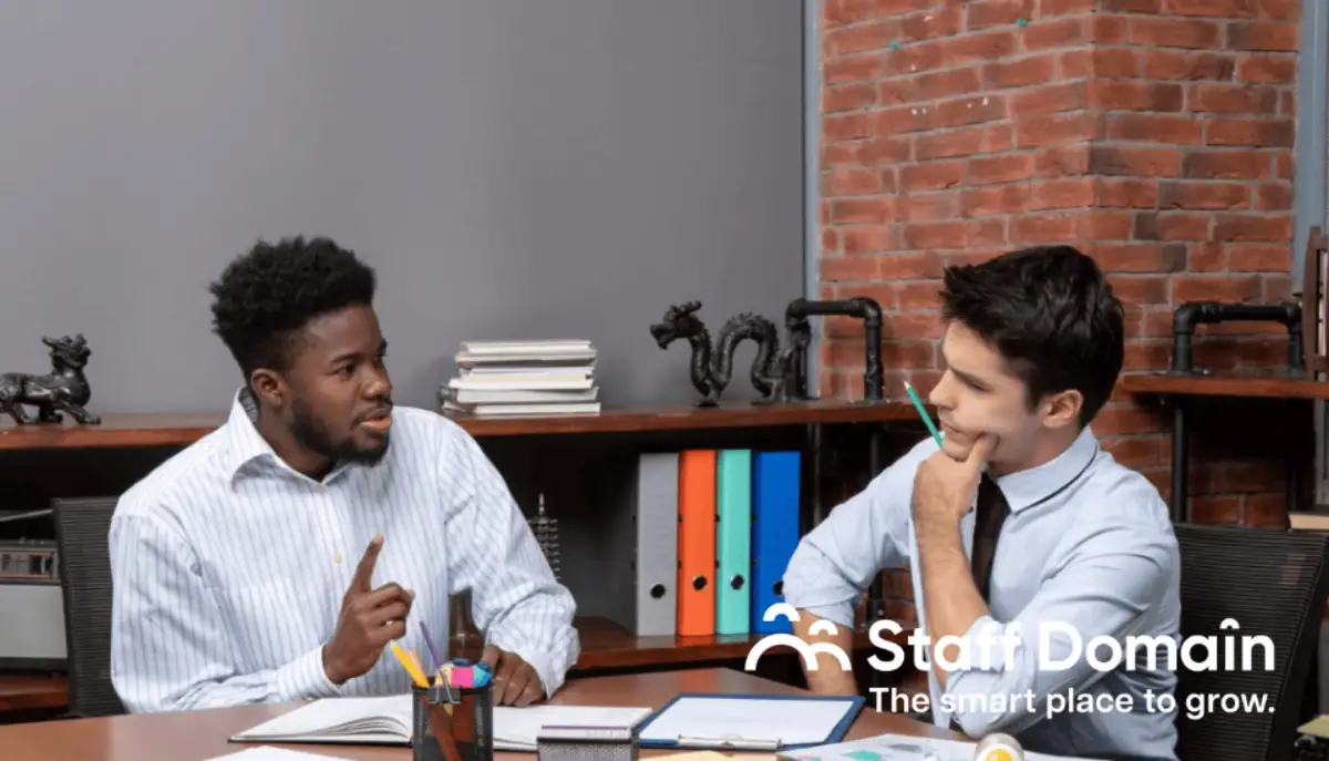 Two employees are talking about outsourcing vs. offshoring