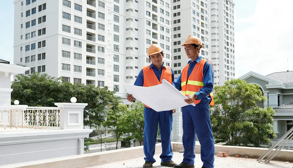 two engineers talking about the sustainability goals in infrastructure projects