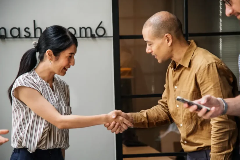 Shaking hands of co-workers