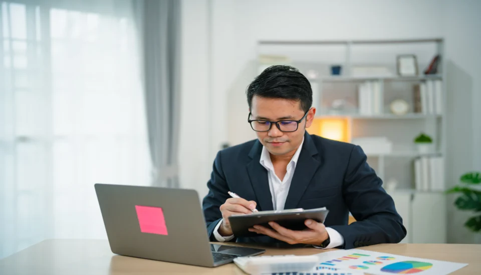 Male Offshore accountant calculating the financial report