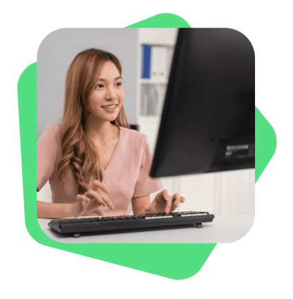 thumbnail-smiling-outsourced-marketing-services-employee-working-at-her-desk